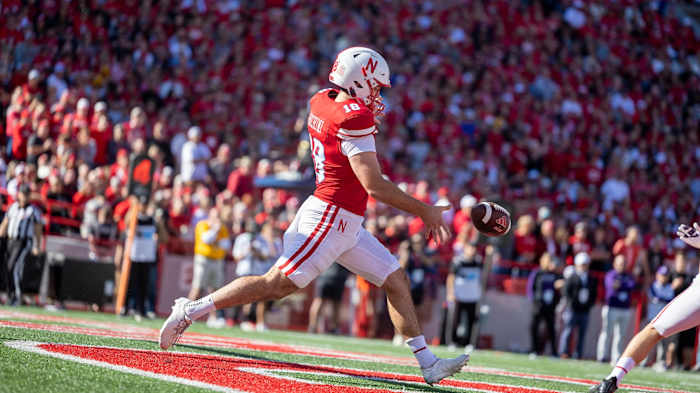 Nebraska punter Brian Buschini fires off a punt against Northwestern (Oct. 21, 2023)